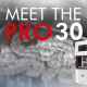 Image showing the PRO 30 with 3D Printed dentures and a background of its build platform with 3D printed surgical guides