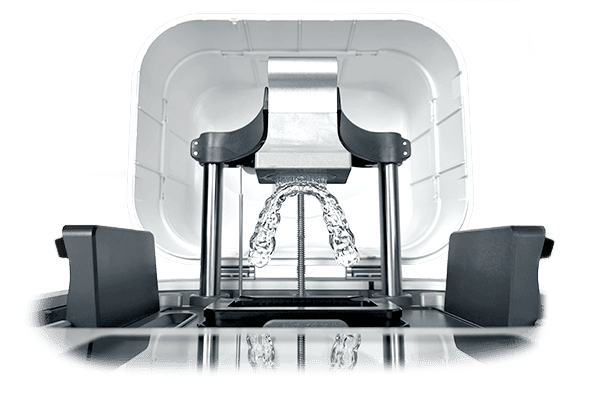 Zoom in of the ONE 3D Printer with Dental Splints on its Rapid Print Kit Build Platform